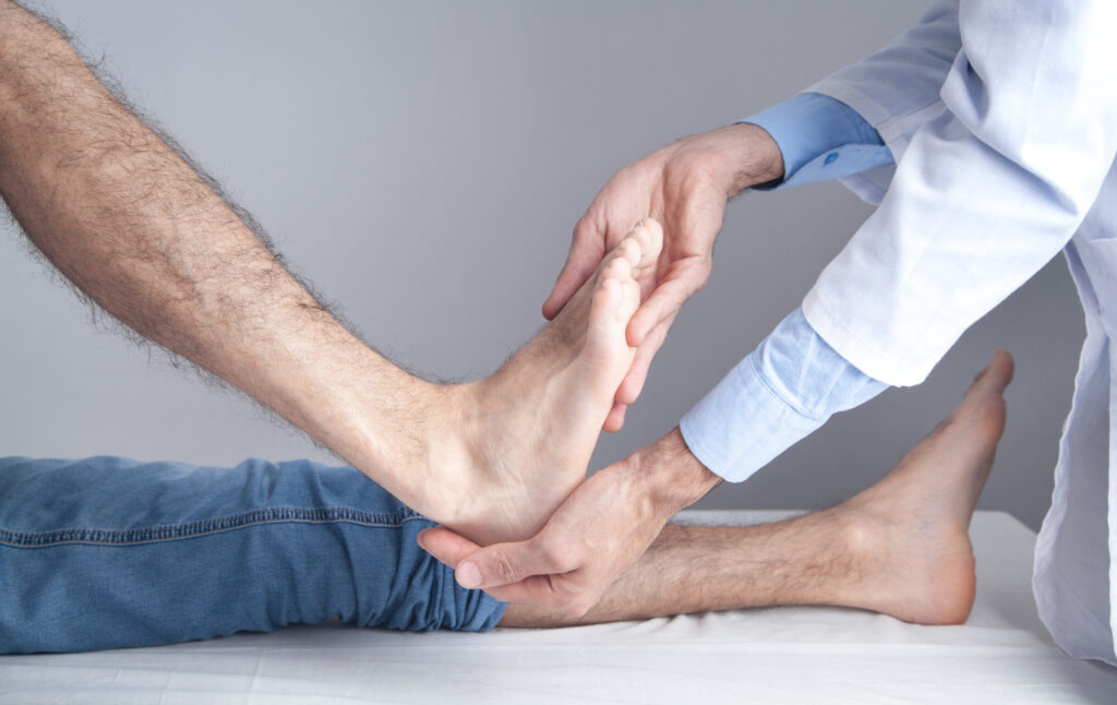 caucasian-doctor-examining-patient-foot